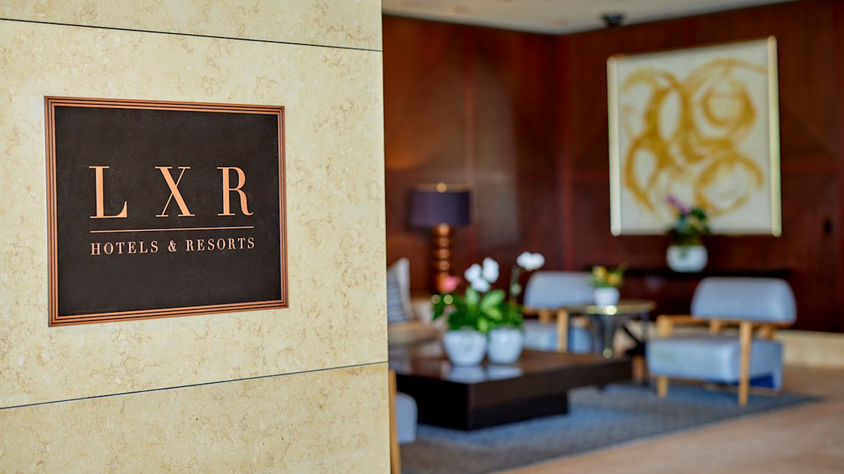 Hotel sign on the wall in the lobby.