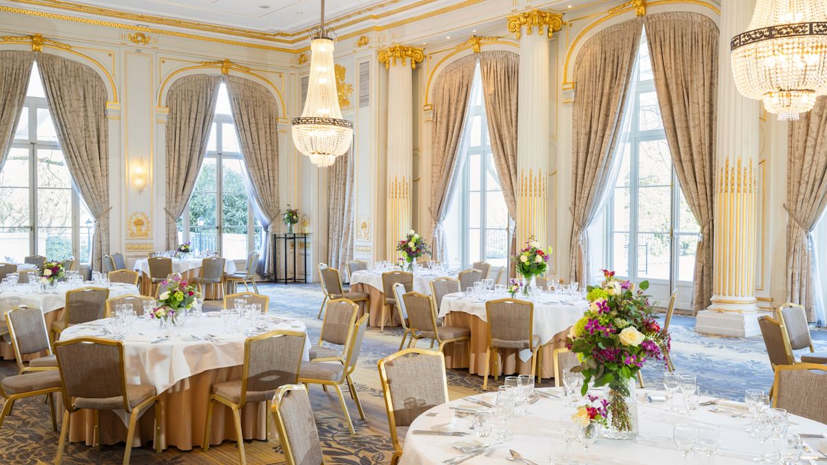 Wedding ballroom setup with floral arrangements