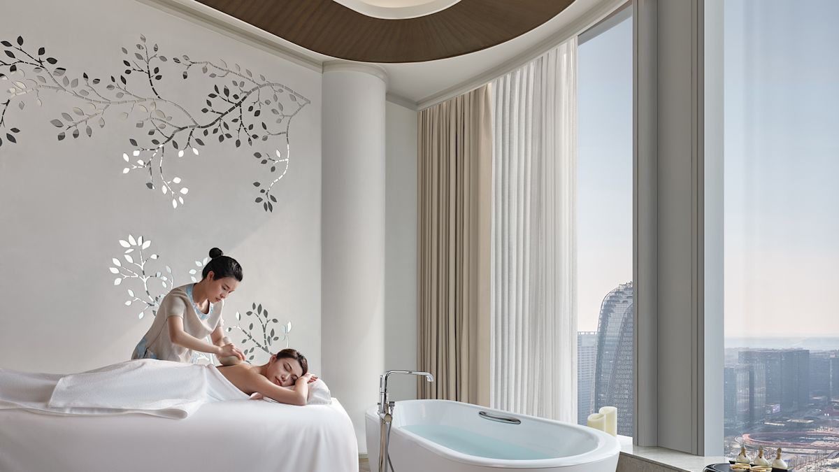 person lying on bed in spa