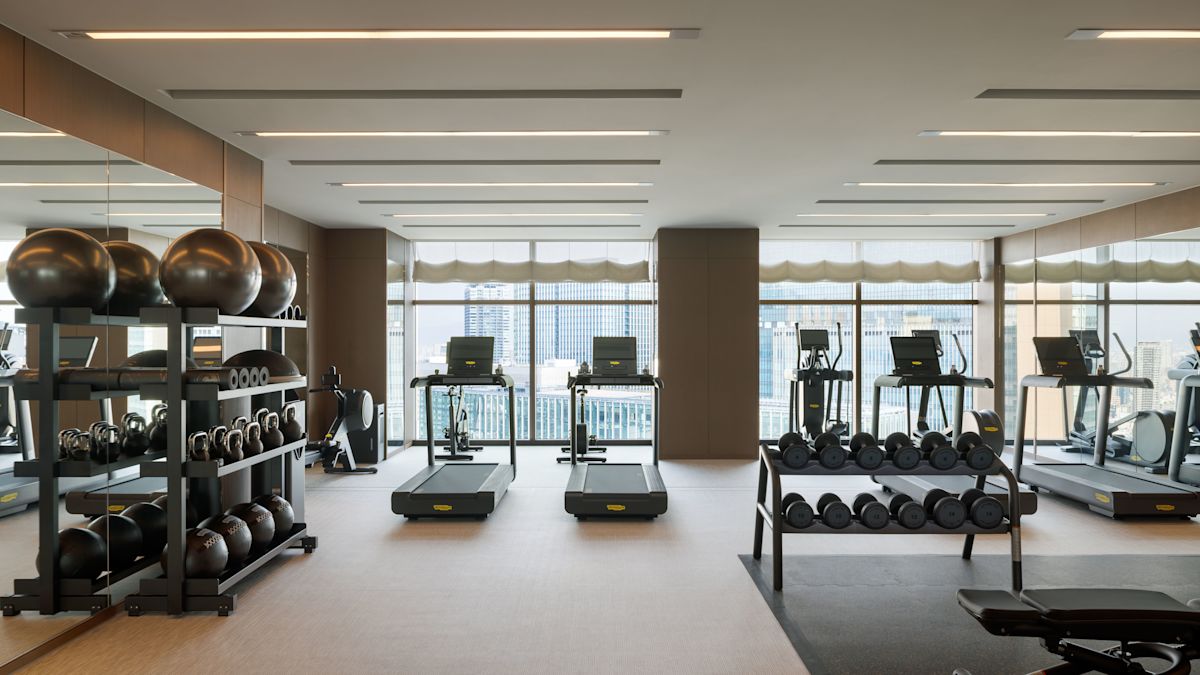 Fitness center with cardio machines and free weights