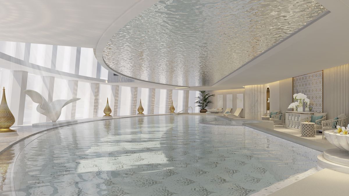 Merender kolam renang dalam ruangan dengan cahaya alami dari jendela