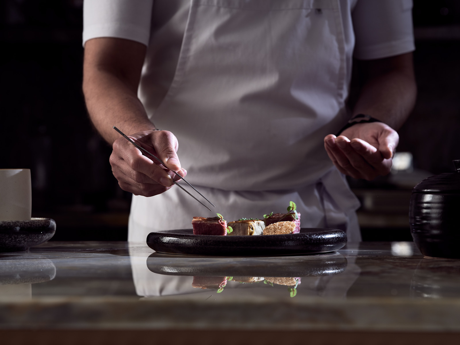 Chef Preparing Food at Cretamos Restaurant