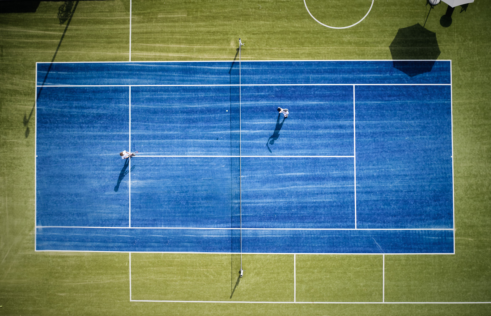 People Playing Tennis on Outdoor Tennis Court