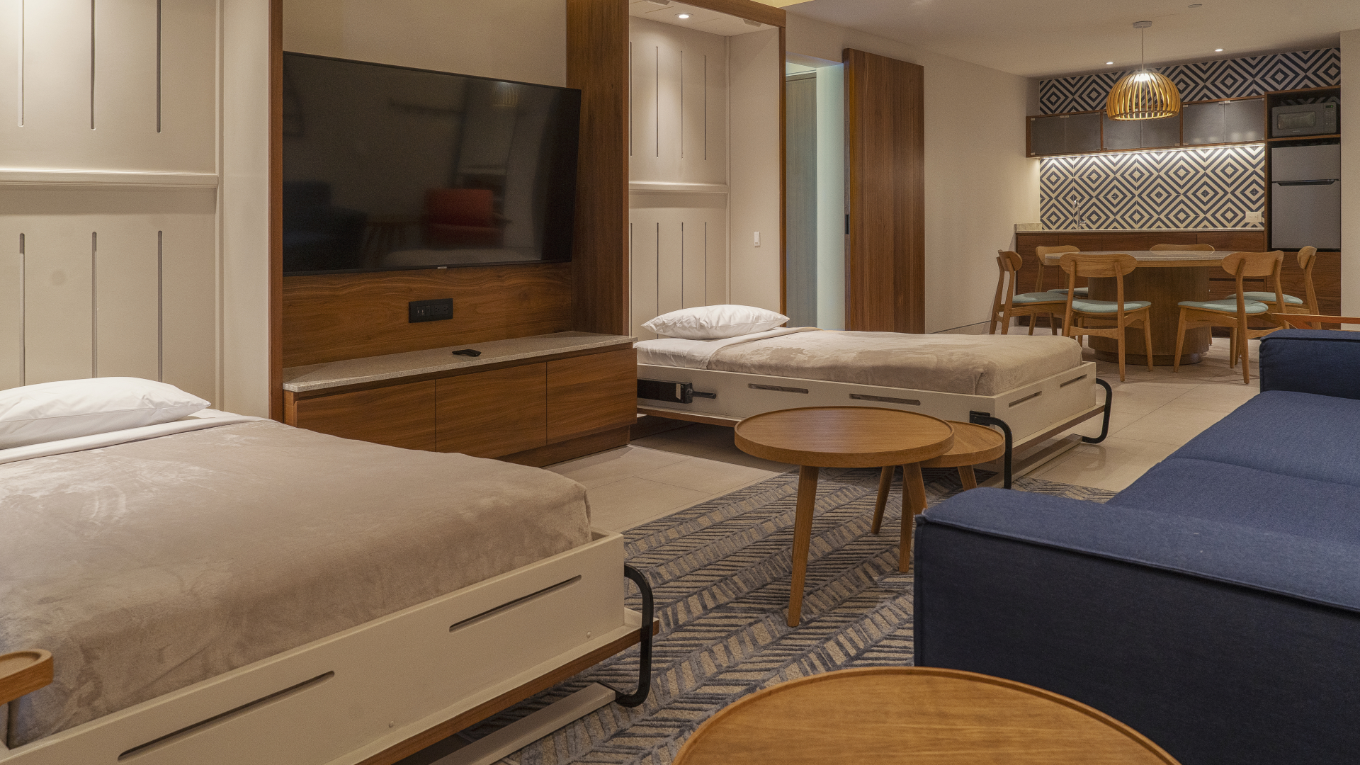 Two beds in room with comfortable seating