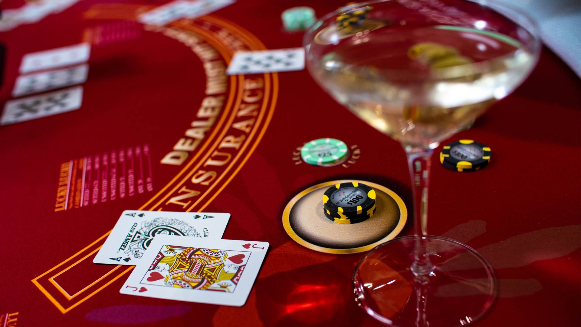 Casino table with cards, chips and drink