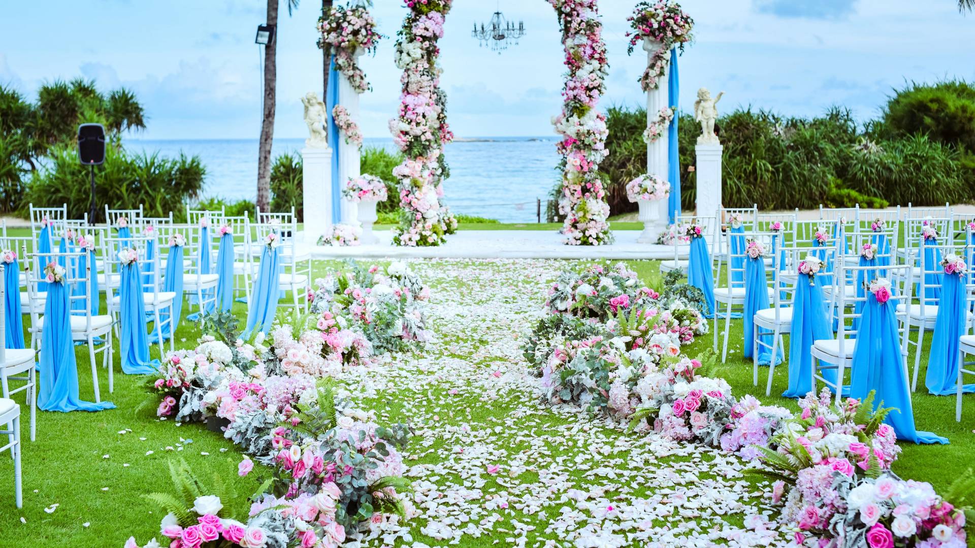 Arch made with colorful flowers for a wedding set up in the garden