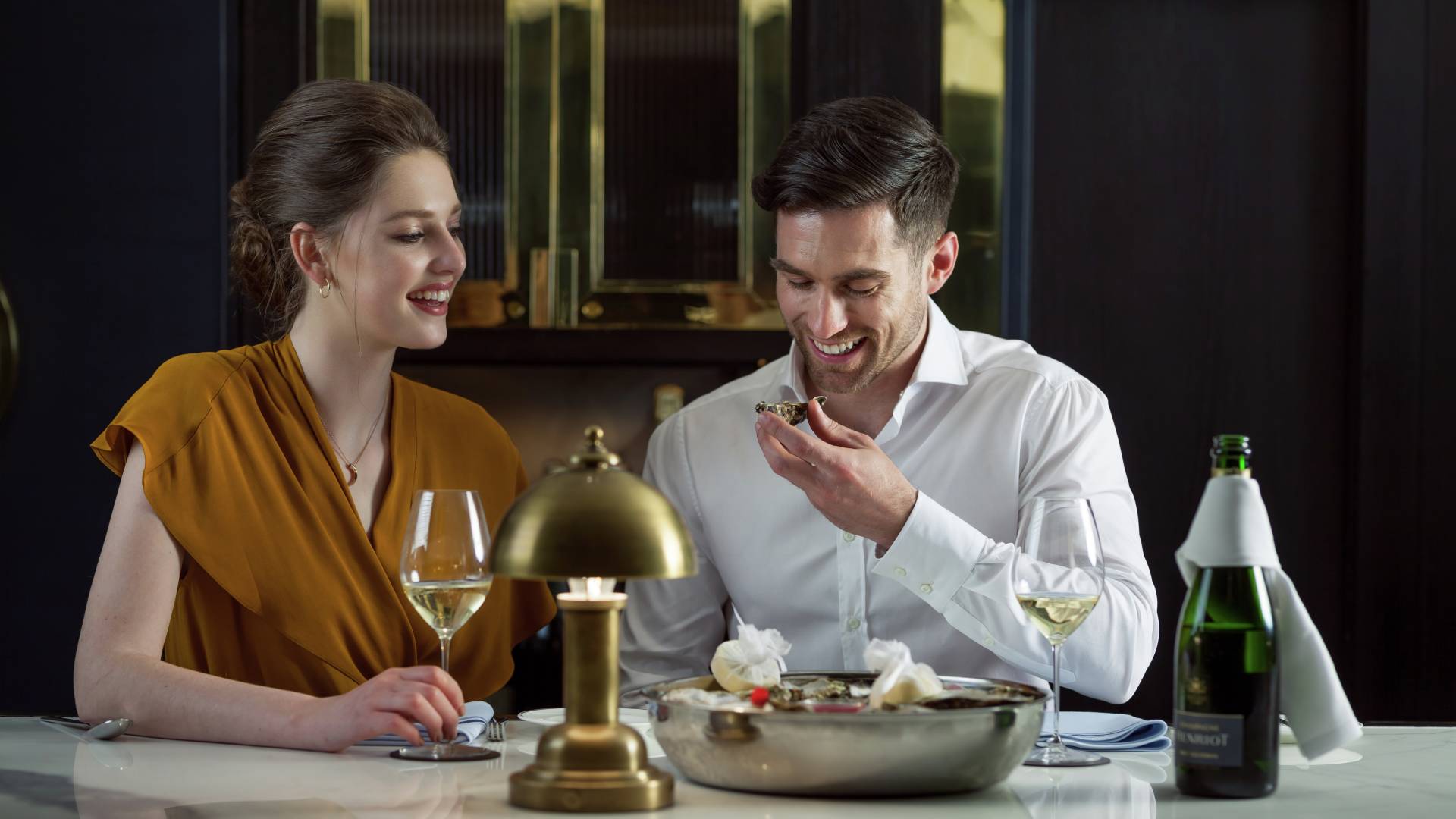 Man and Woman Laughing over Meal