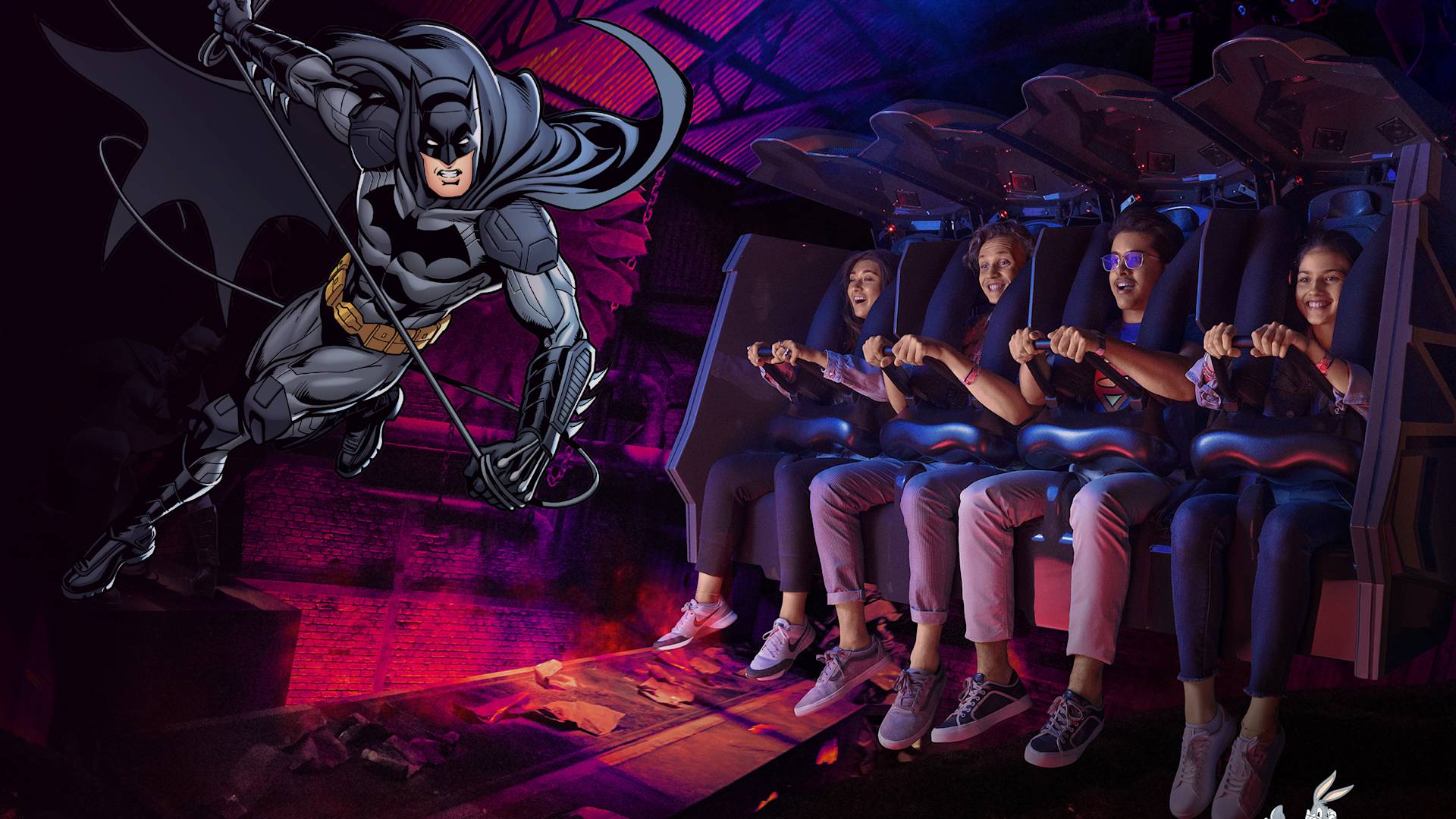 Warner bros theme park Batman branded image with people on rollercoaster