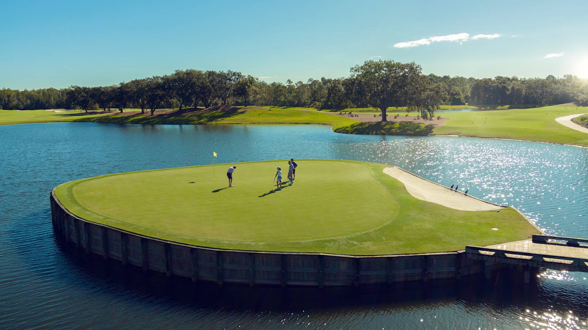 A group of people Golfing on Golf course