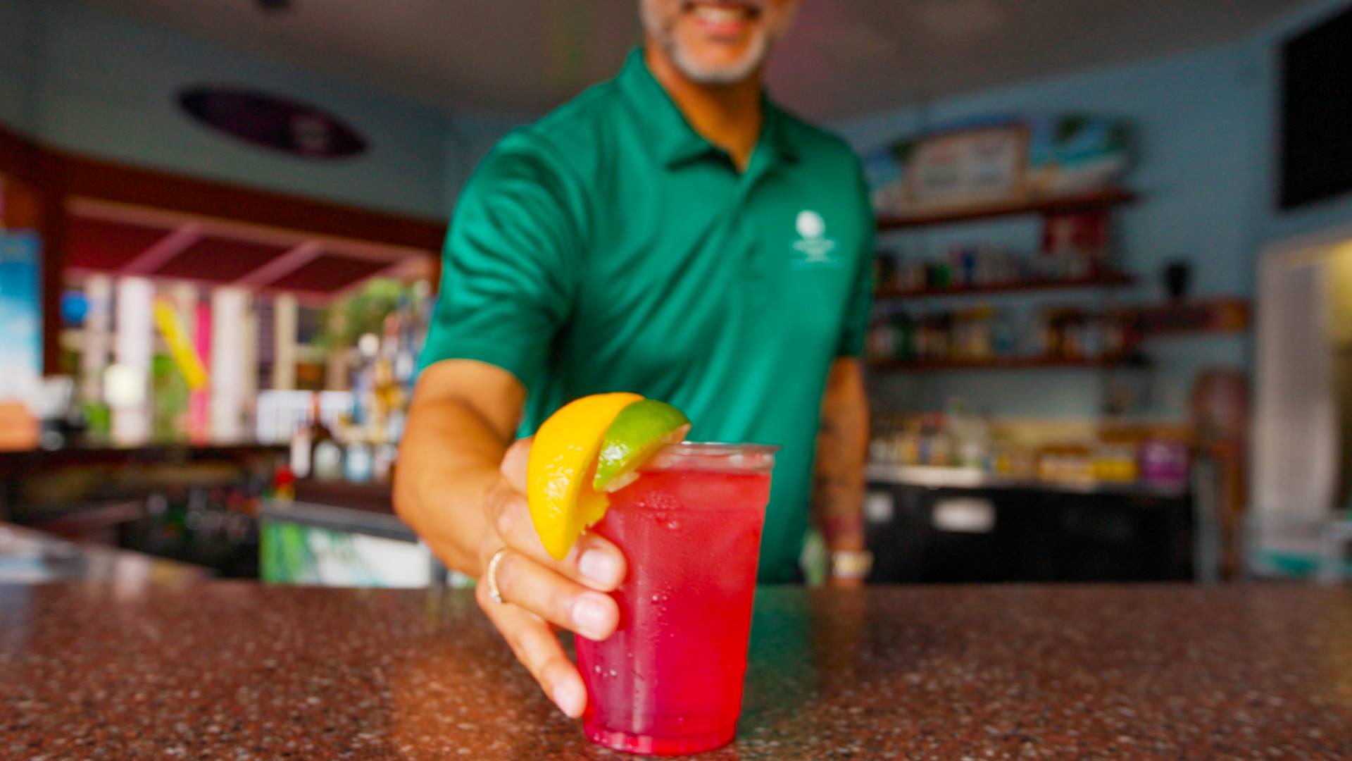 Batender Holding a Drink at Barefoot