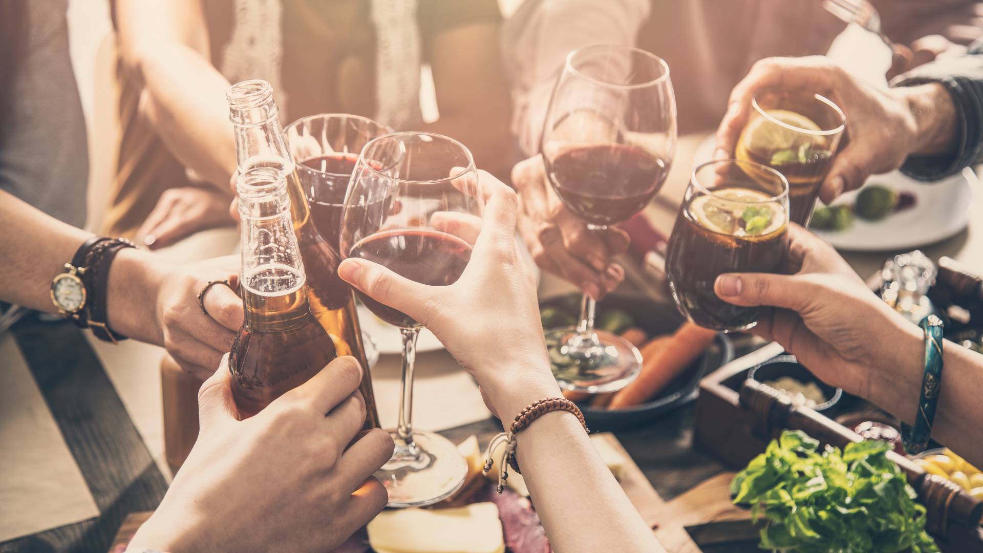 a group of people drinking beer and wine on a tour