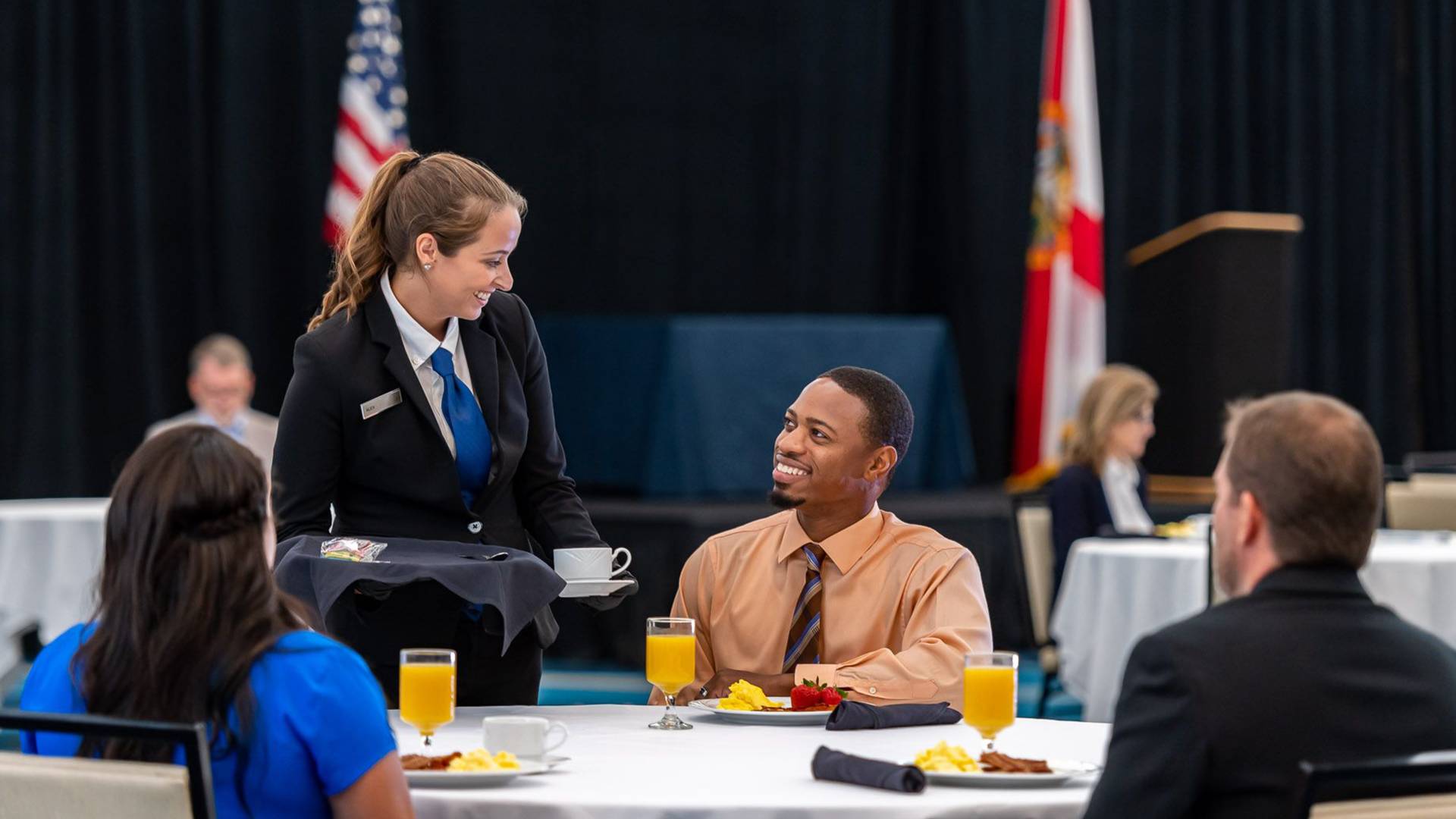 Waiting staff serving customers