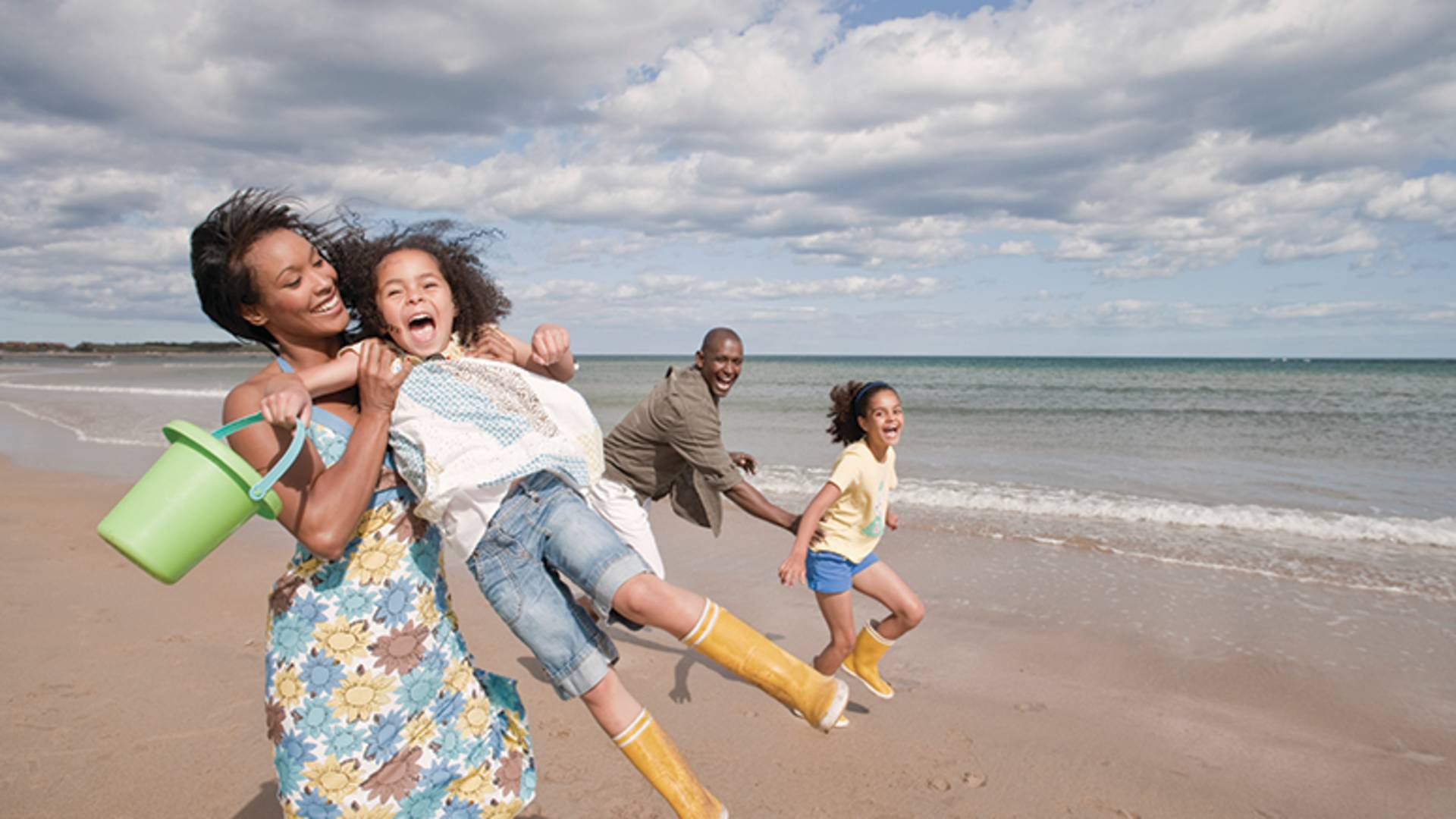 Family having fun on the beach