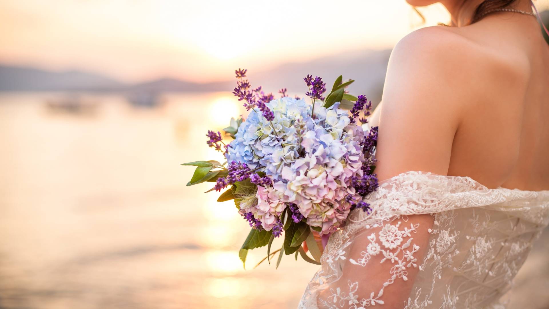 Closeup of bride and bouquet with the ocean in background