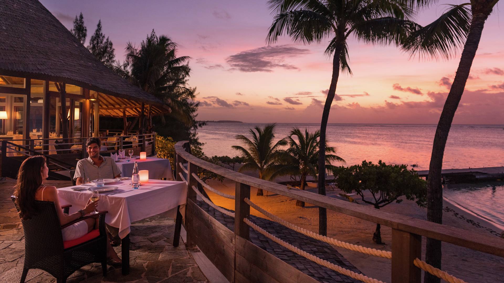 Couple Dining at Sunset on Restaurant Terrace