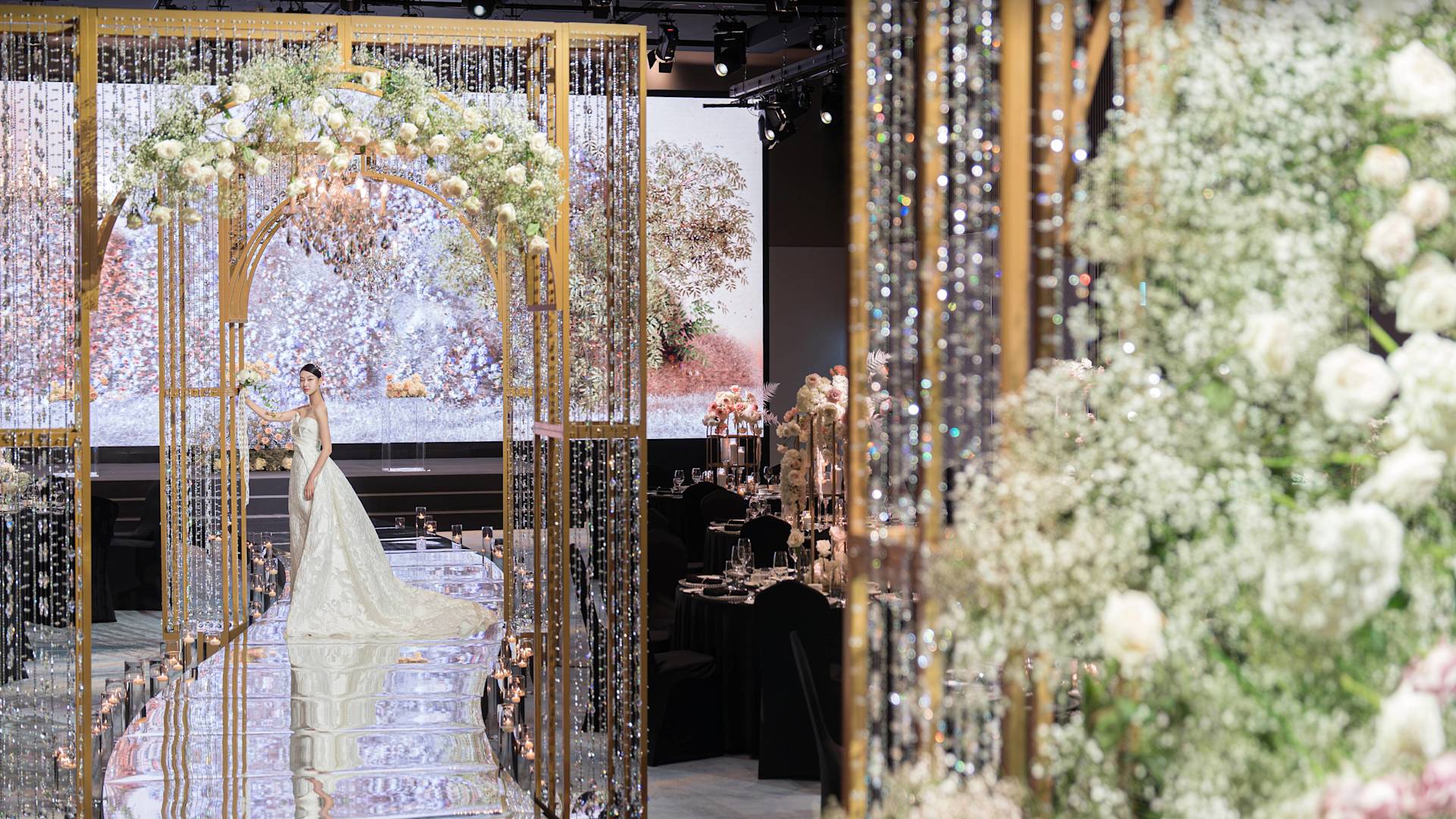 lady standing under gold alter