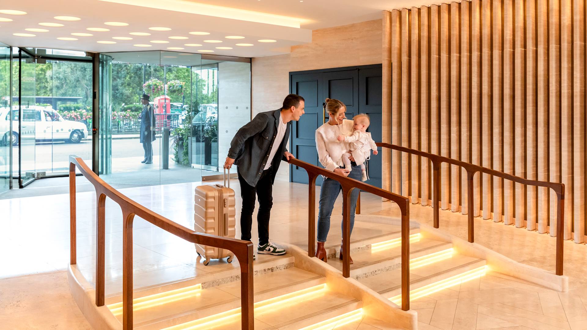 Couple with Baby Arriving at the Hotel