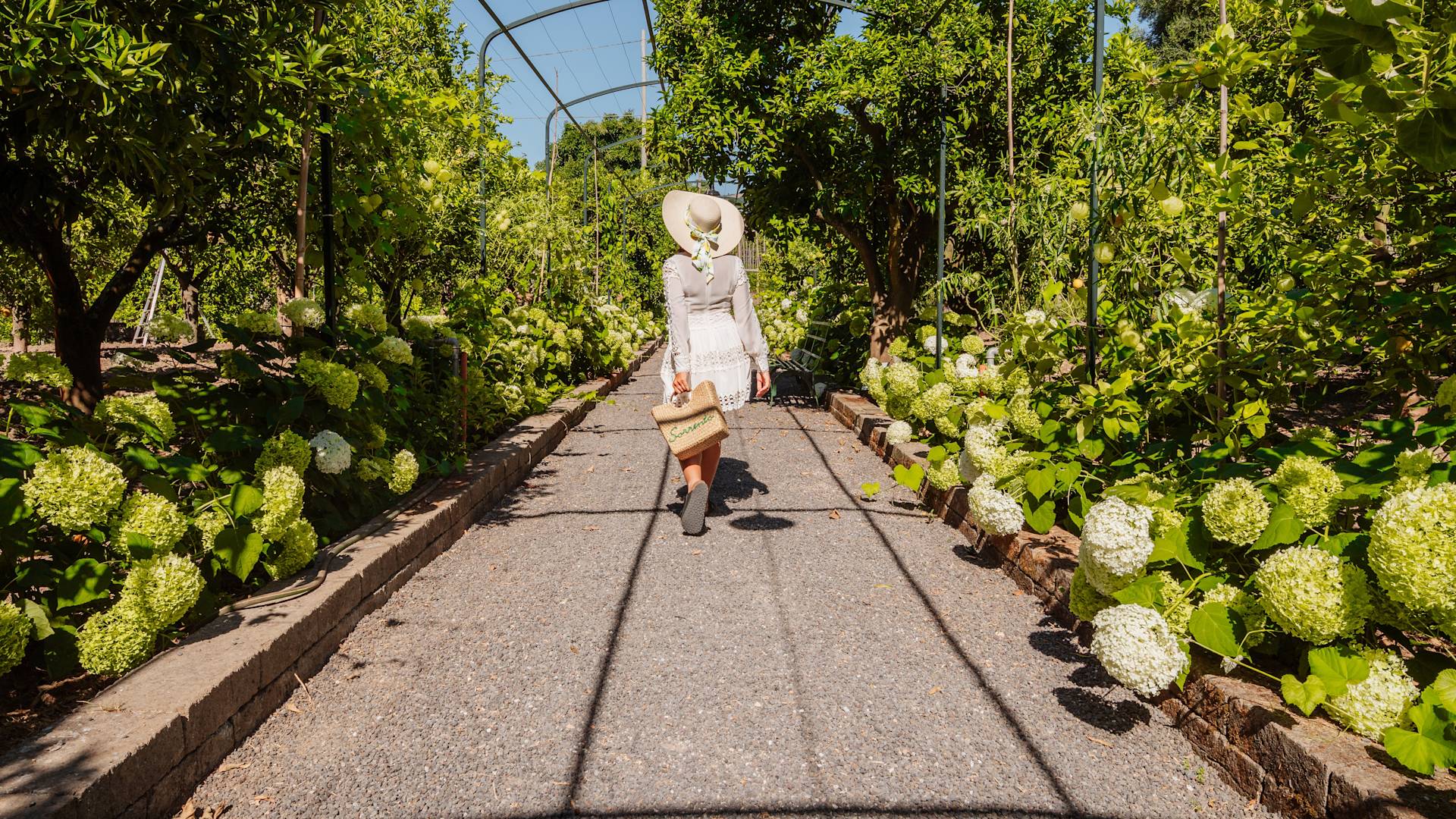 Woman Walking in a Garden