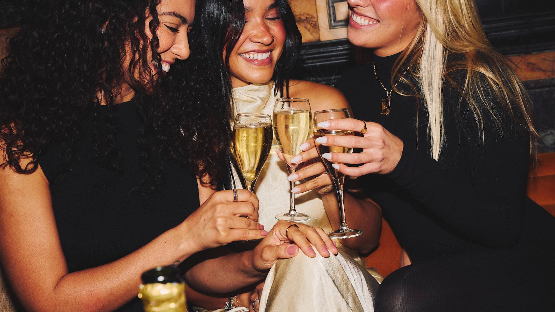 marble bar guests toasting with champagne