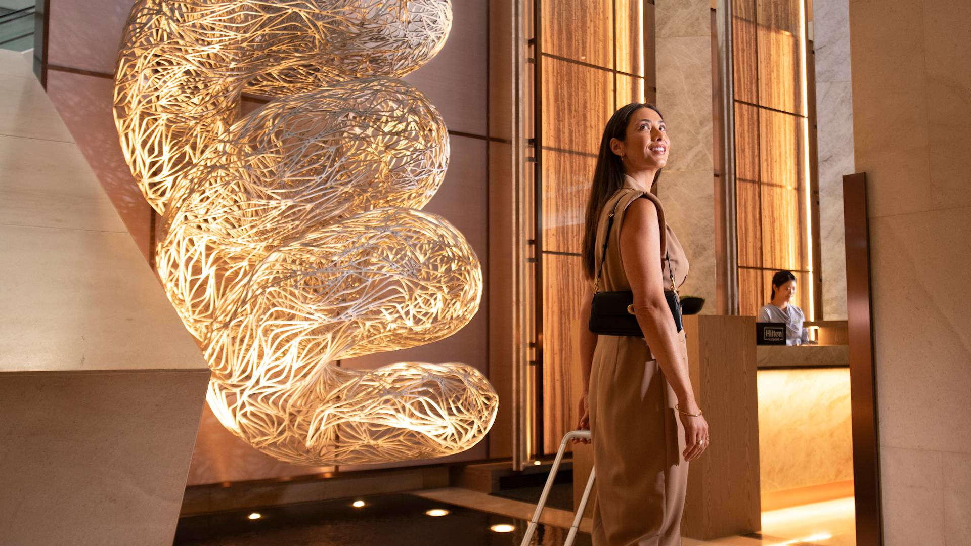 Woman Admiring the Decor in Lobby Area