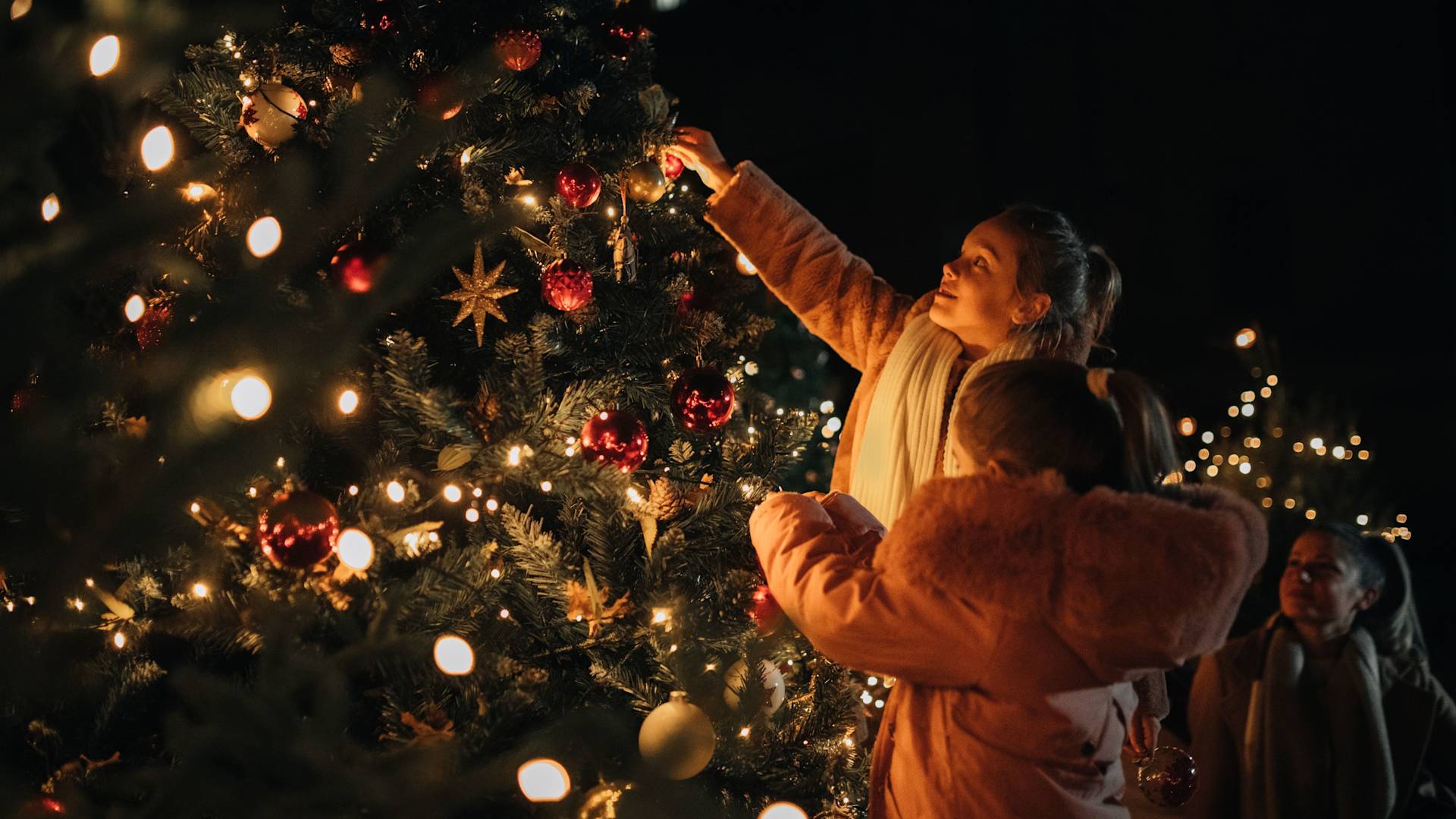 Kids Decorating a Christmas Tree for the Holiday