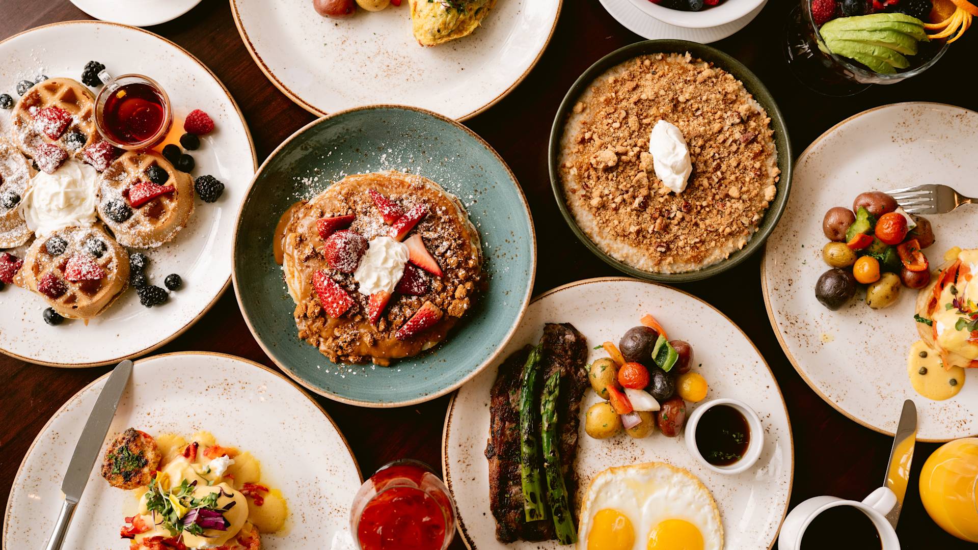 multiple plates of food on table
