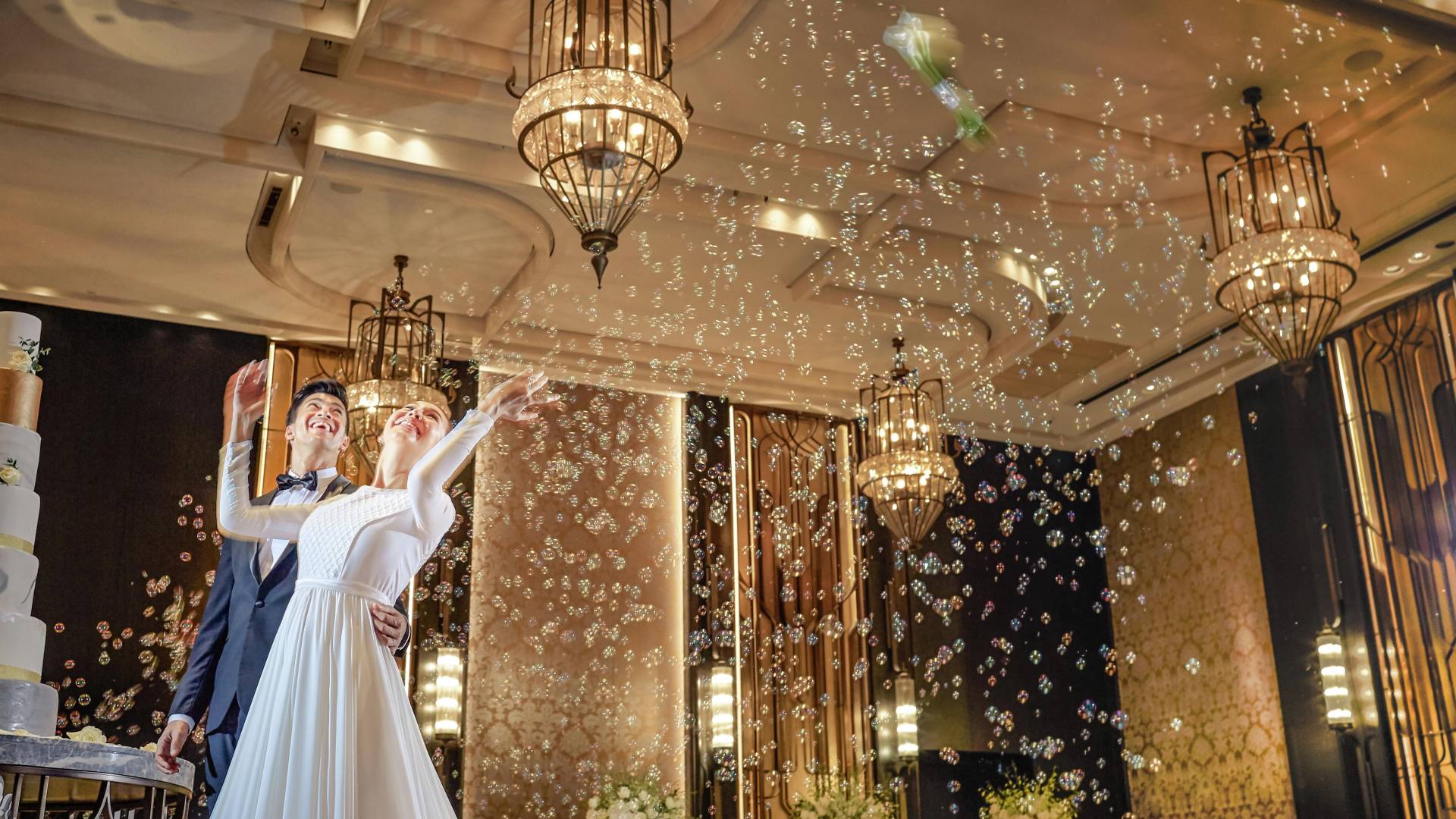 A wedding couple in a hotel ballroom