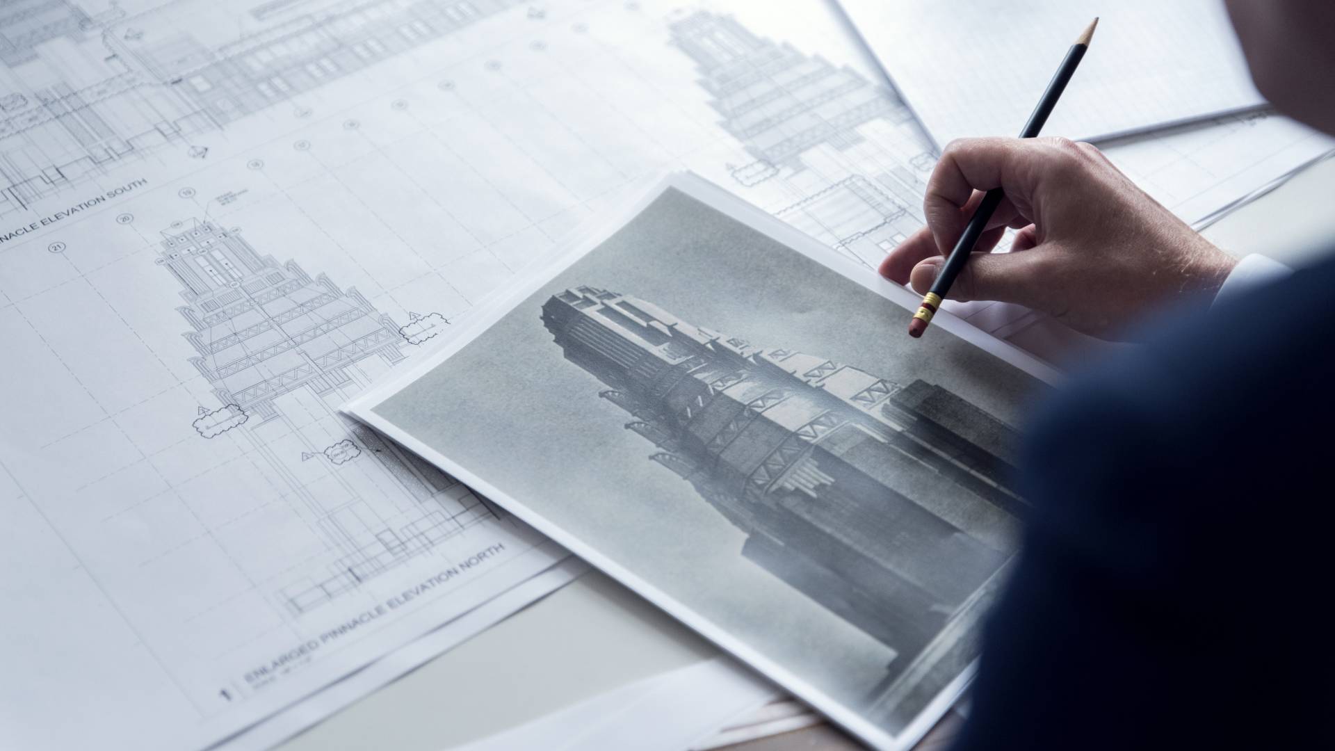 a business man looking at a picture of a building