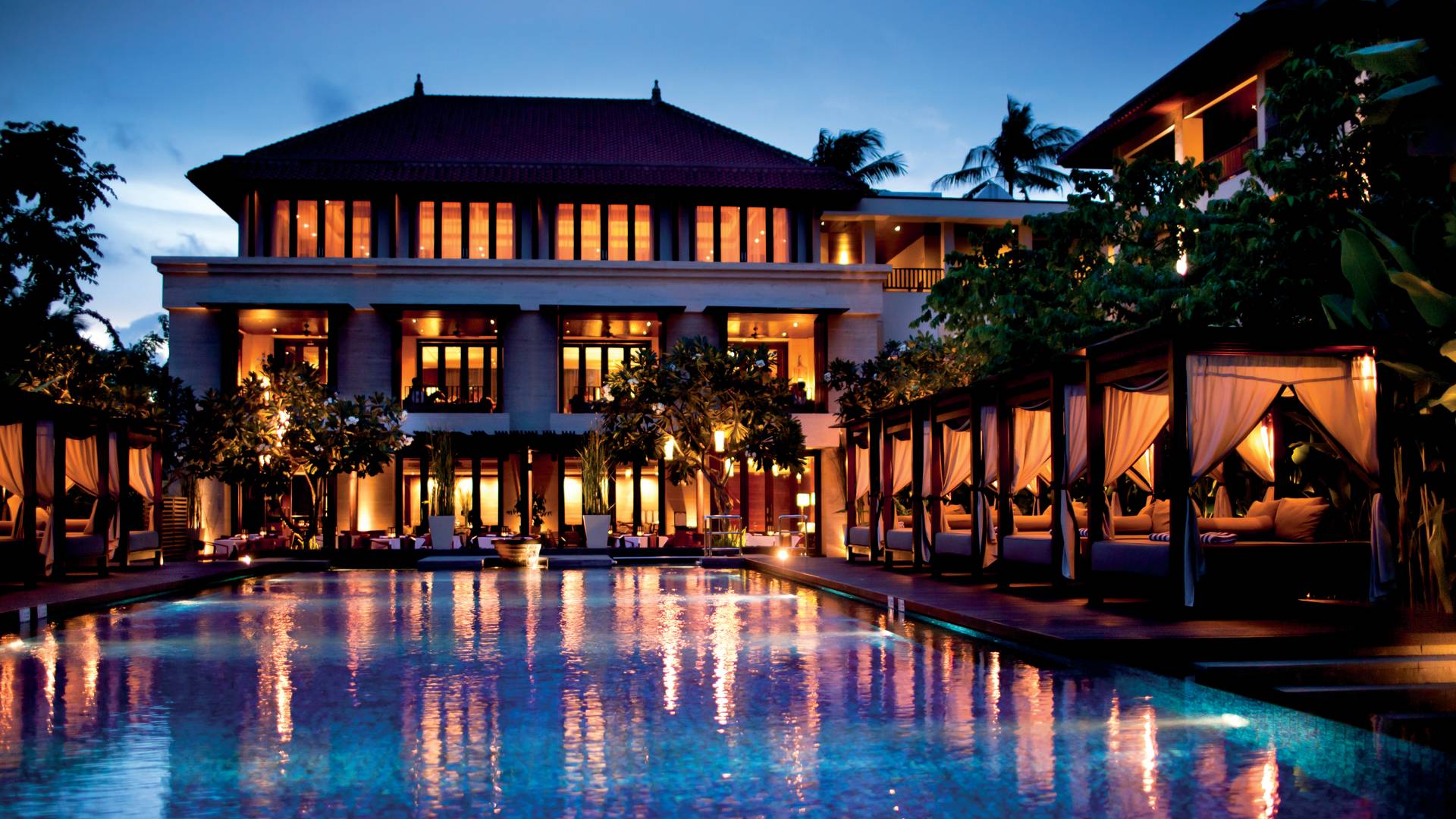 Pool with Poolside Cabanas at Night
