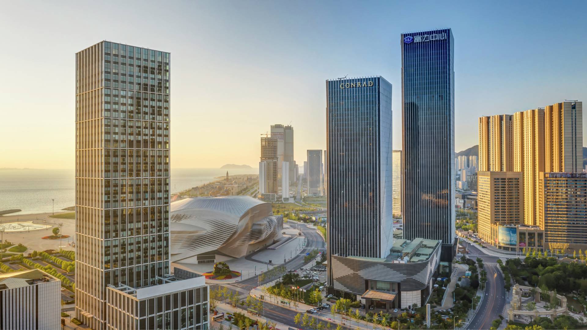Hotel exterior with buildings and sea