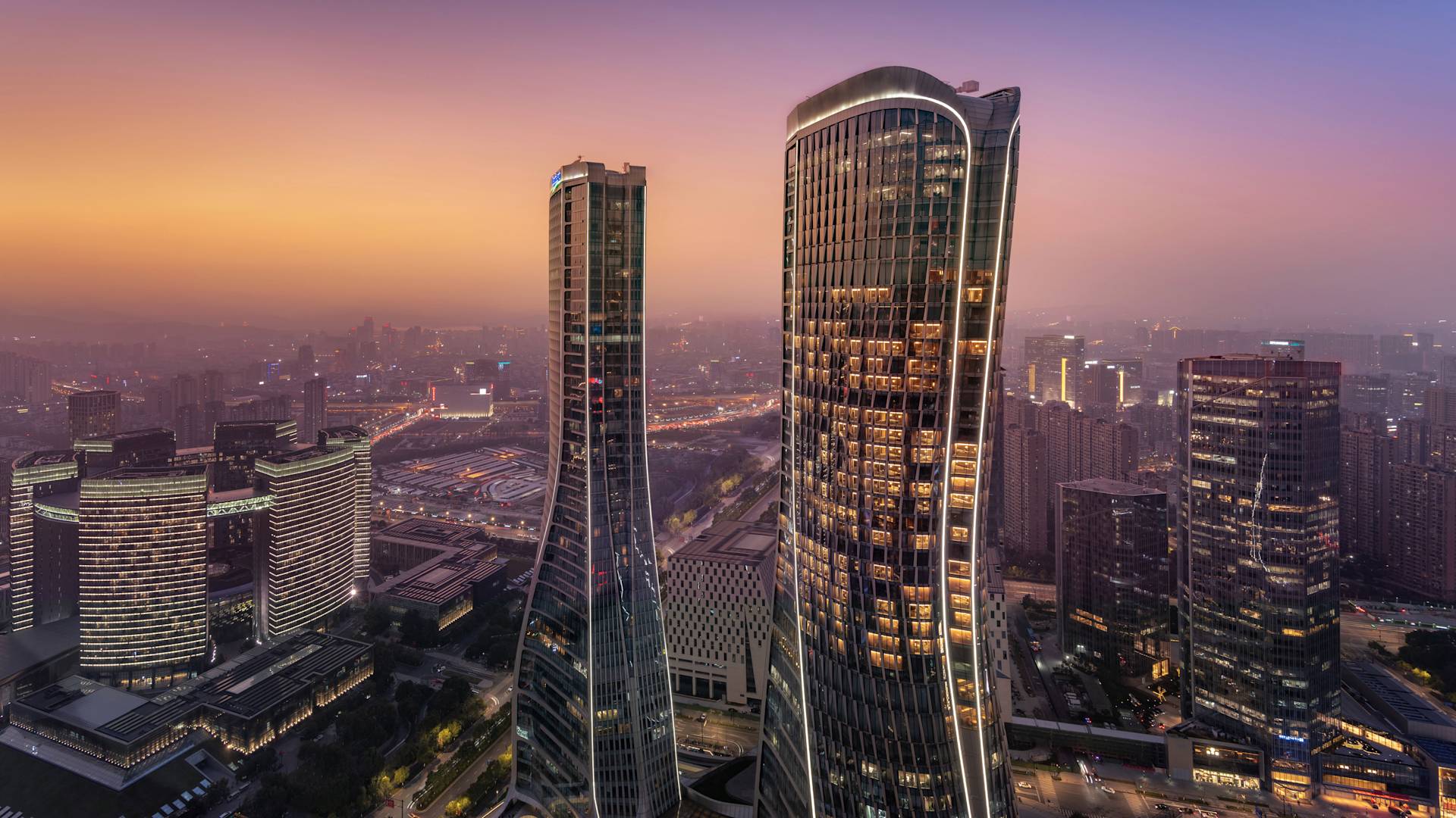 View of the Conrad Hangzhou exterior at dusk
