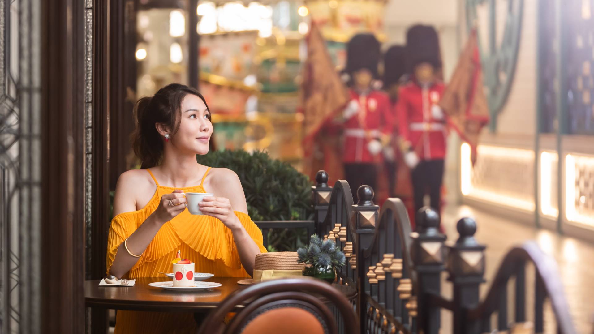 a woman having coffee on a terrace at Churchill's Table Restaurant