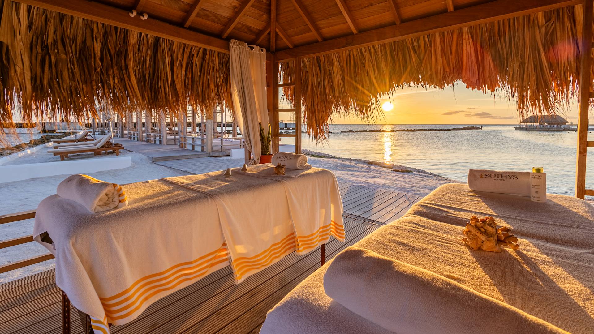 Massage Tables in a Covered Area Outdoors with View of the Beach