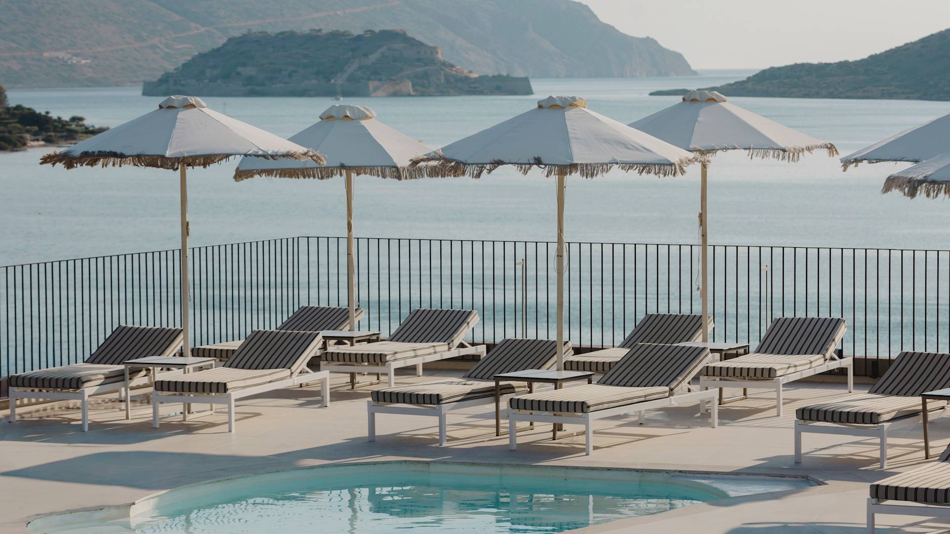 Exterior Pool Area with Lounge Chairs