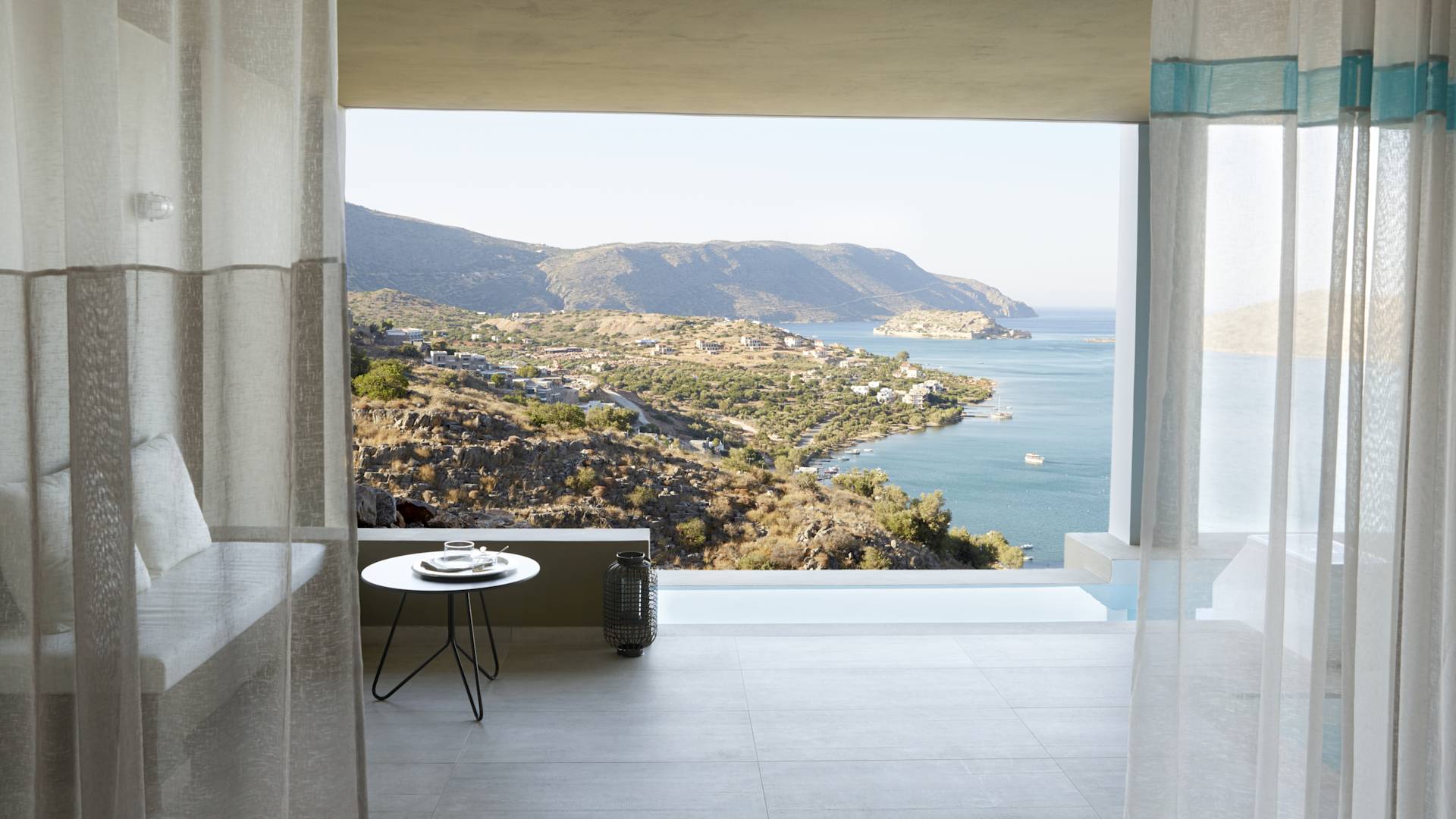 Sapphire Zen suite private pool terrace overlooking the sea and distant hills.