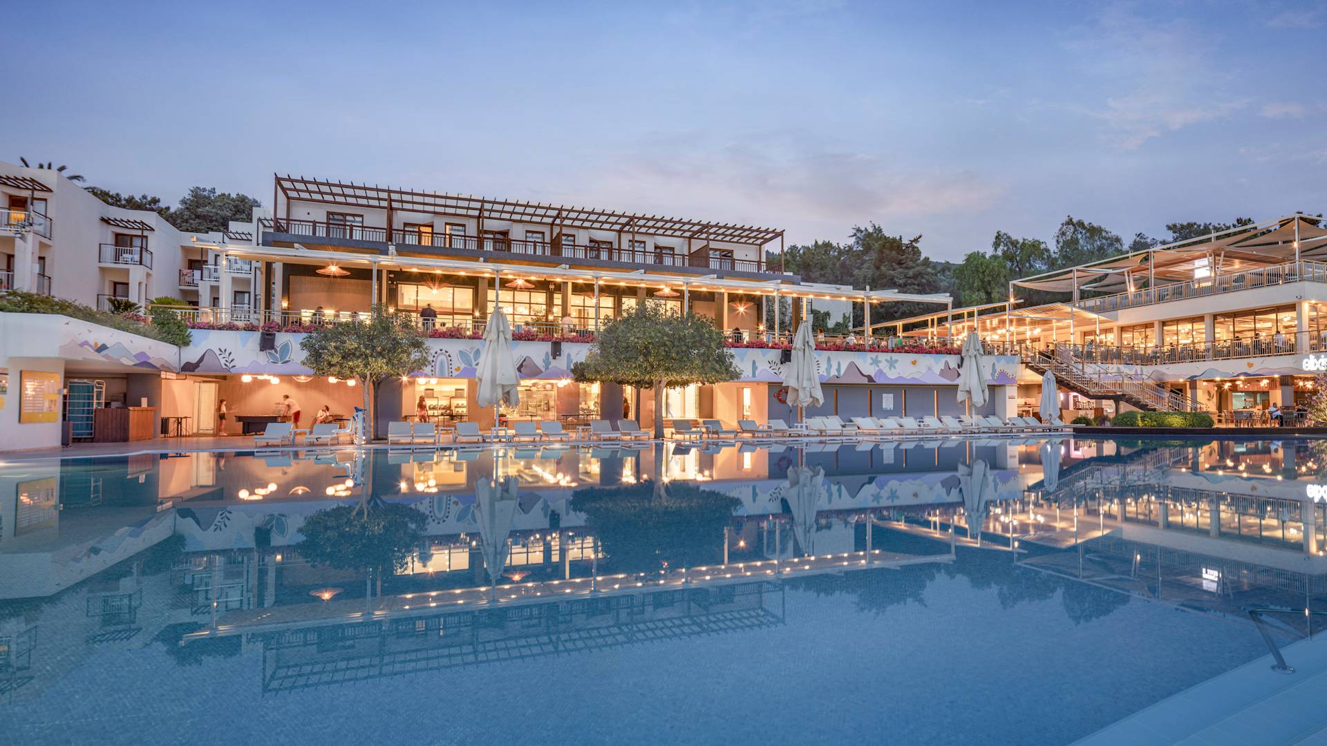 Hotel exterior with body of water in foreground