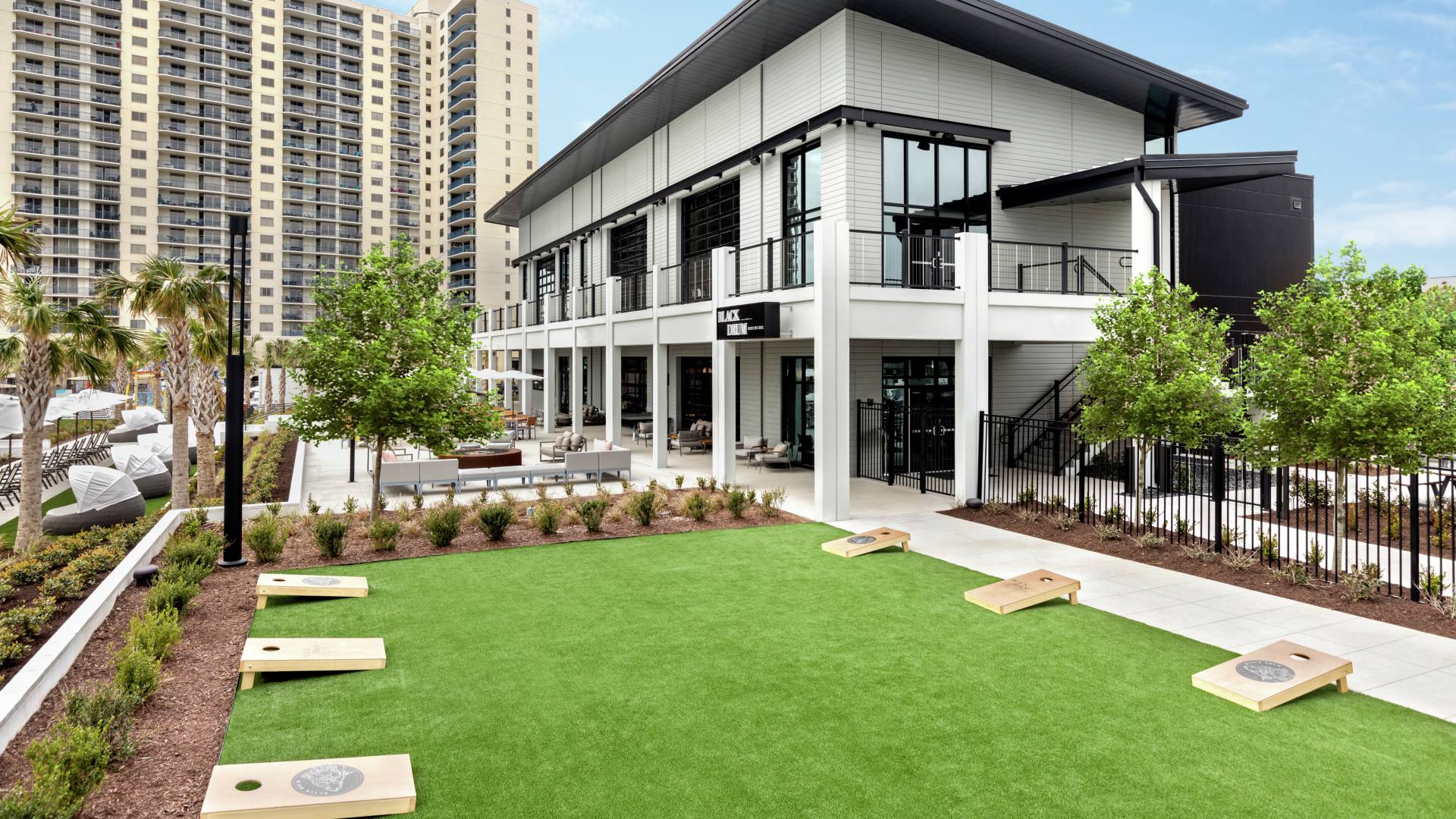 On-site brewery and restaurant featuring outdoor lawn game area