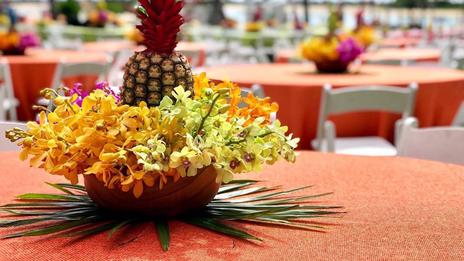 Pineapple and Flowers on a Table at Great Lawn for an  Outdoor Event