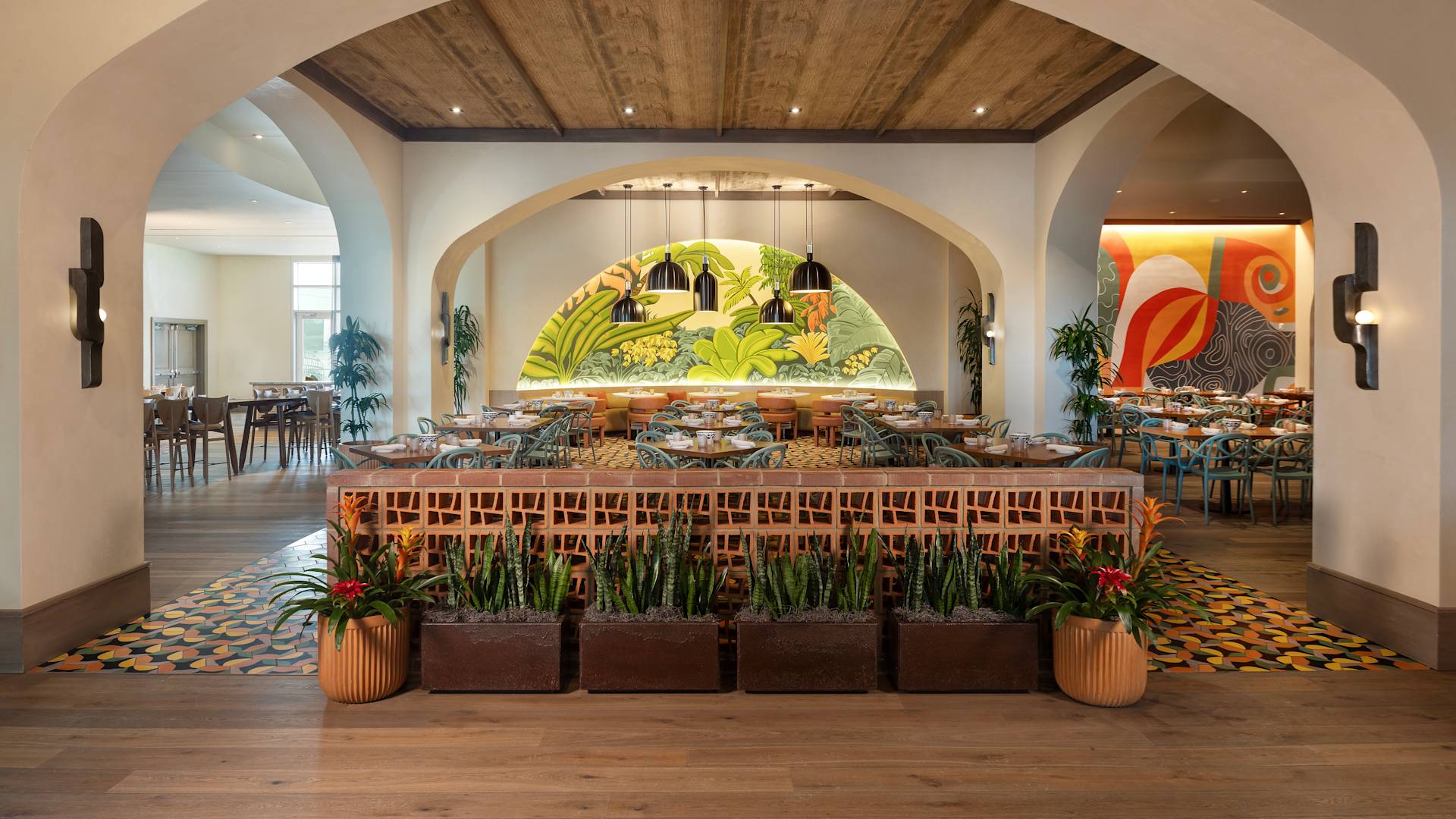 TodoVos restaurant dining room entrance, potted plants