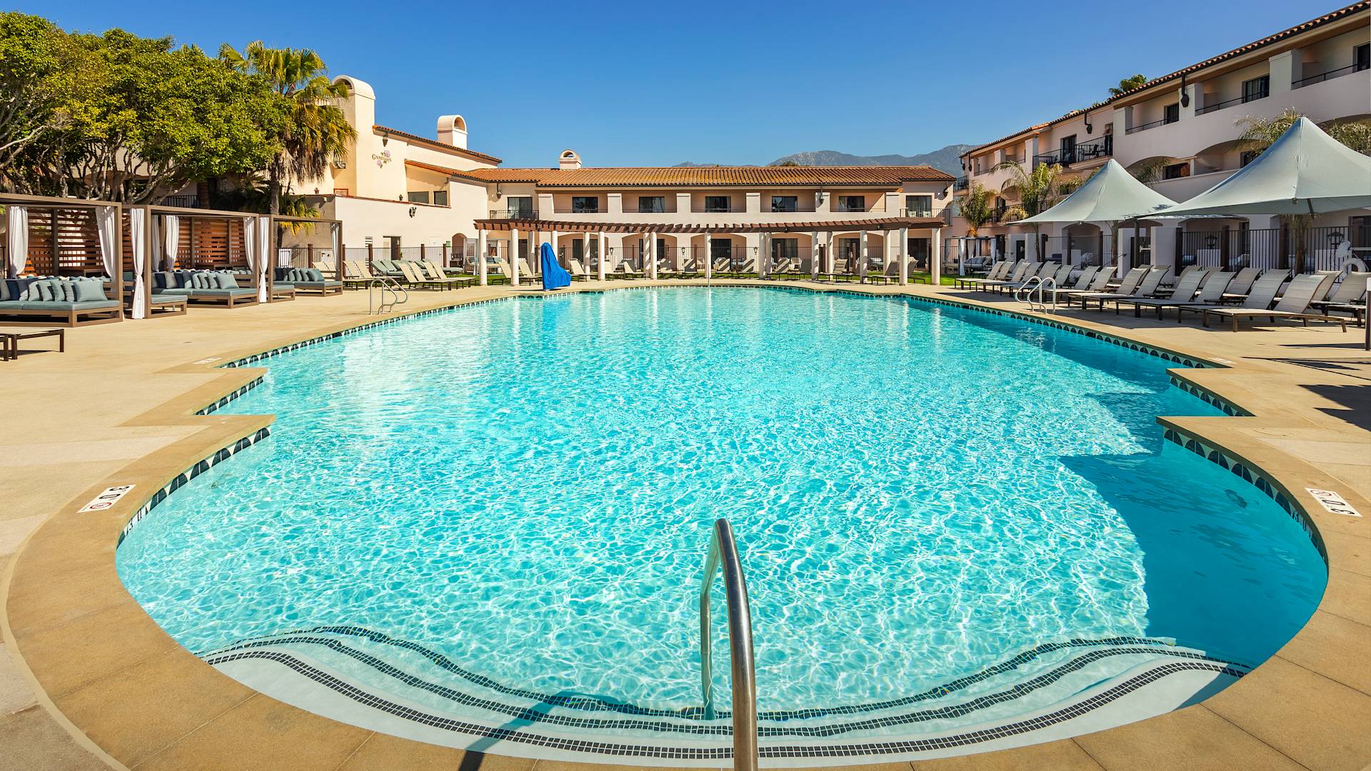 outdoor pool, cabanas, hotel exterior
