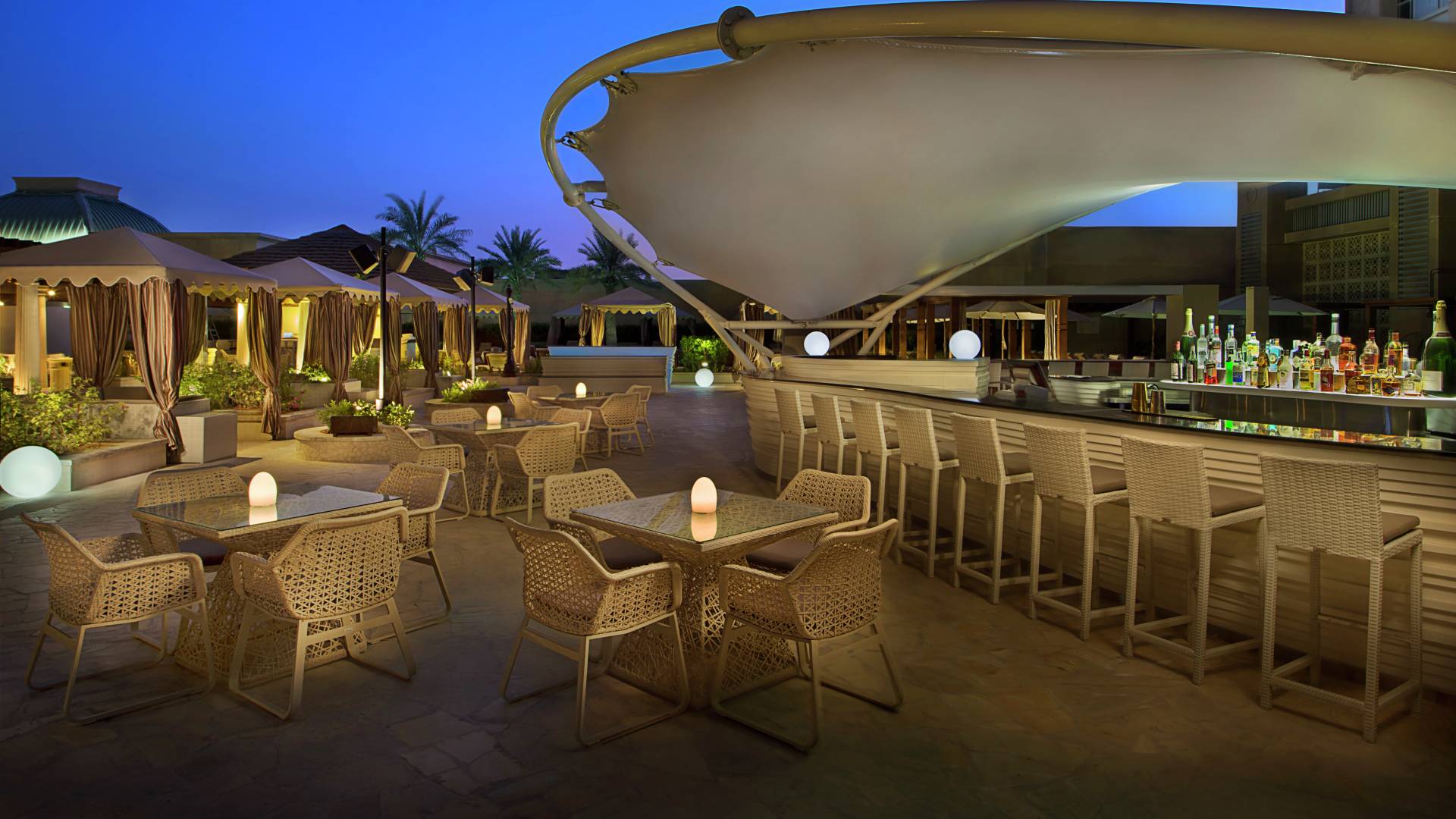 Firefly Poolside Restaurant Lounge Area and Bar at Dusk