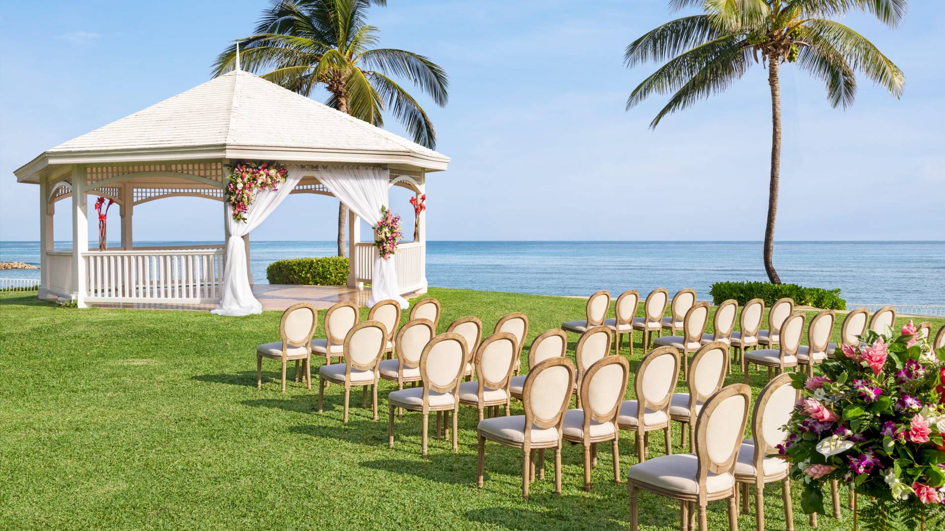 Garden overlooking ocean setup for wedding ceremony
