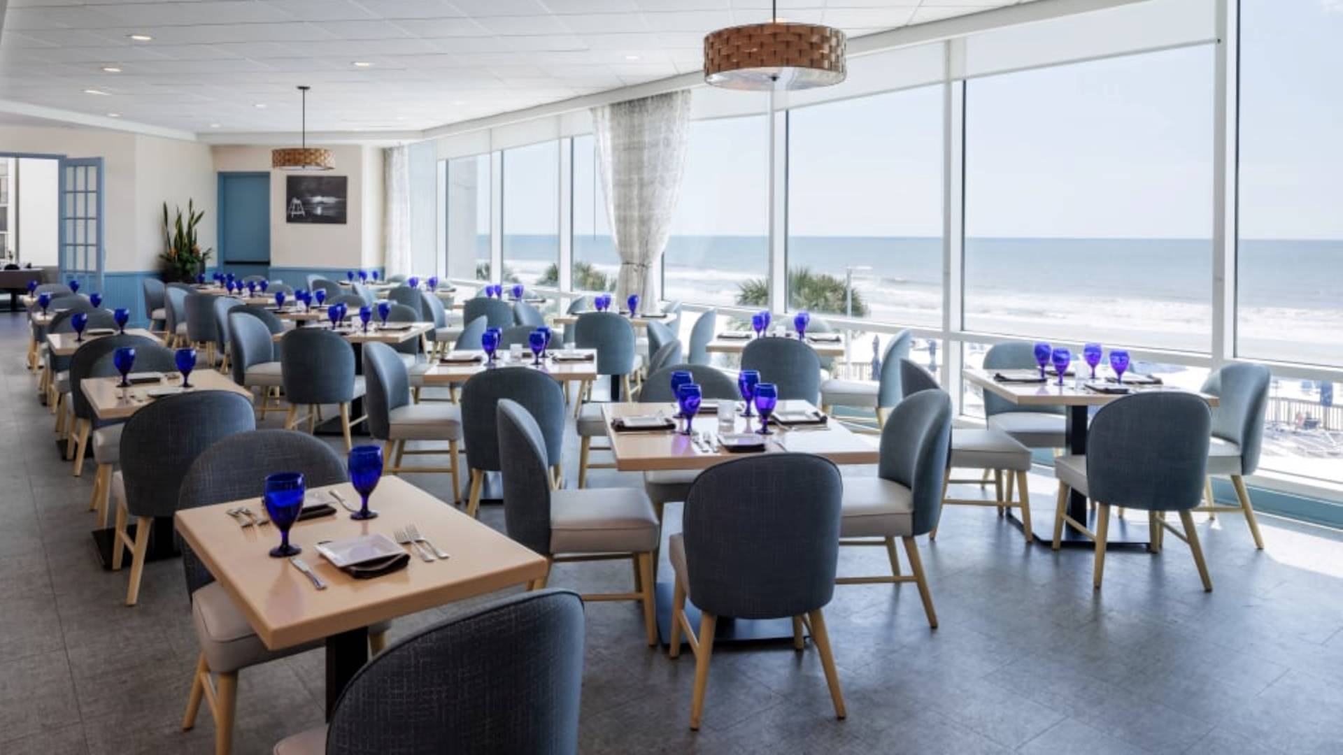 Dining Area of Cafe Amalfi with Beach View from Large Windows