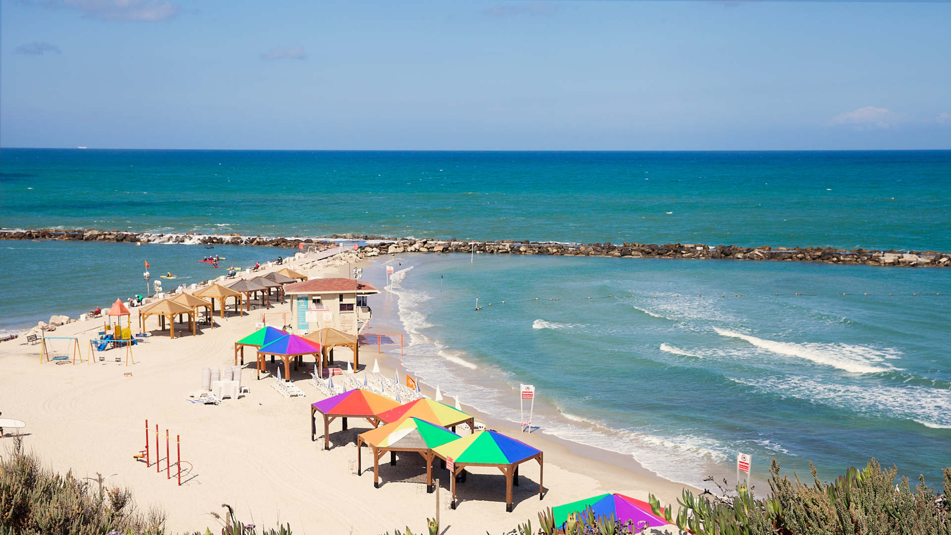 Beach area with umbrellas and huts