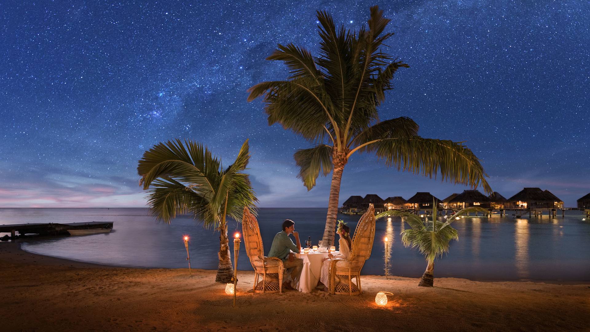 Couple Having a Romantic Dinner on Private Beach at