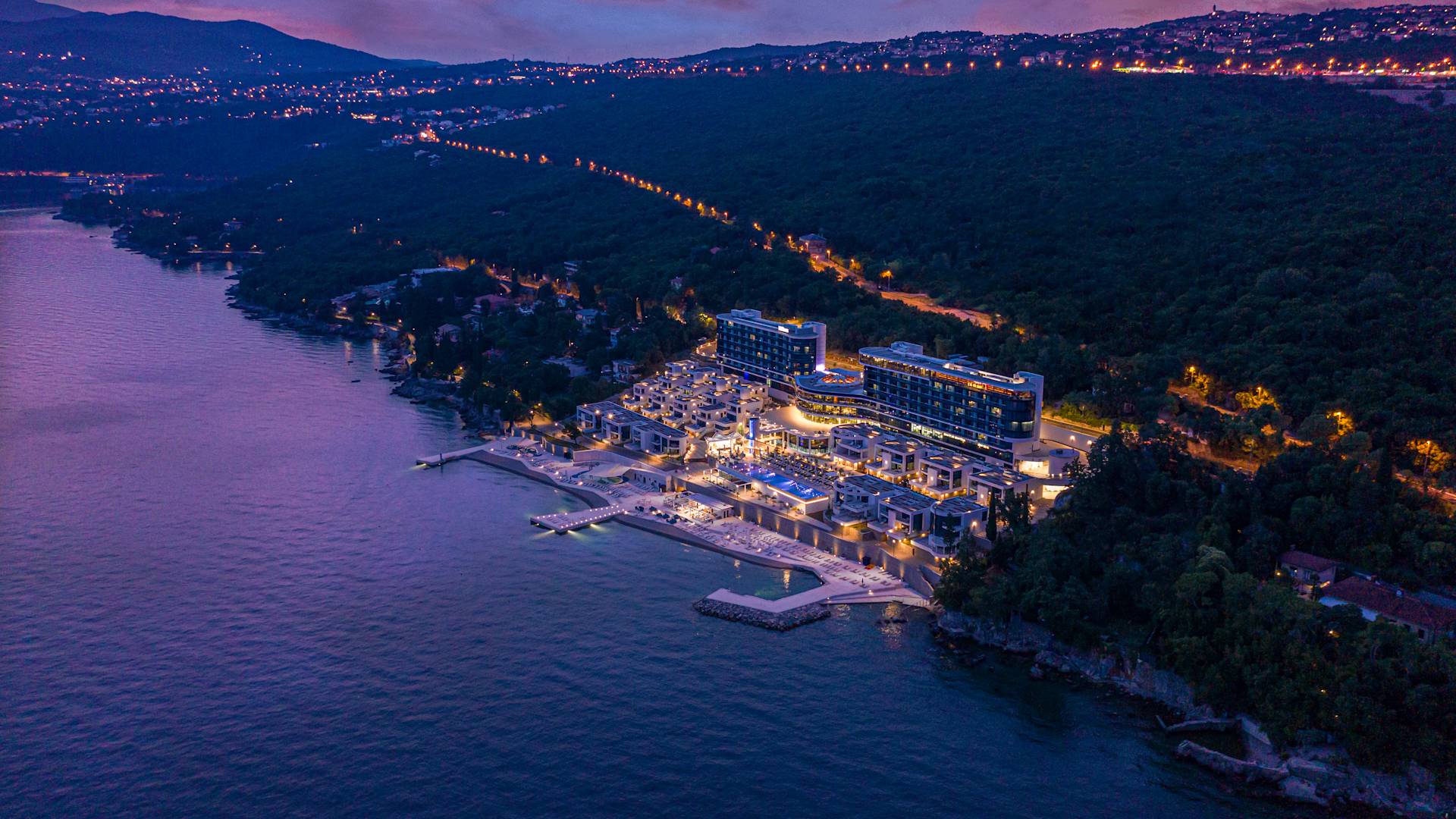 Aerial view of property at night