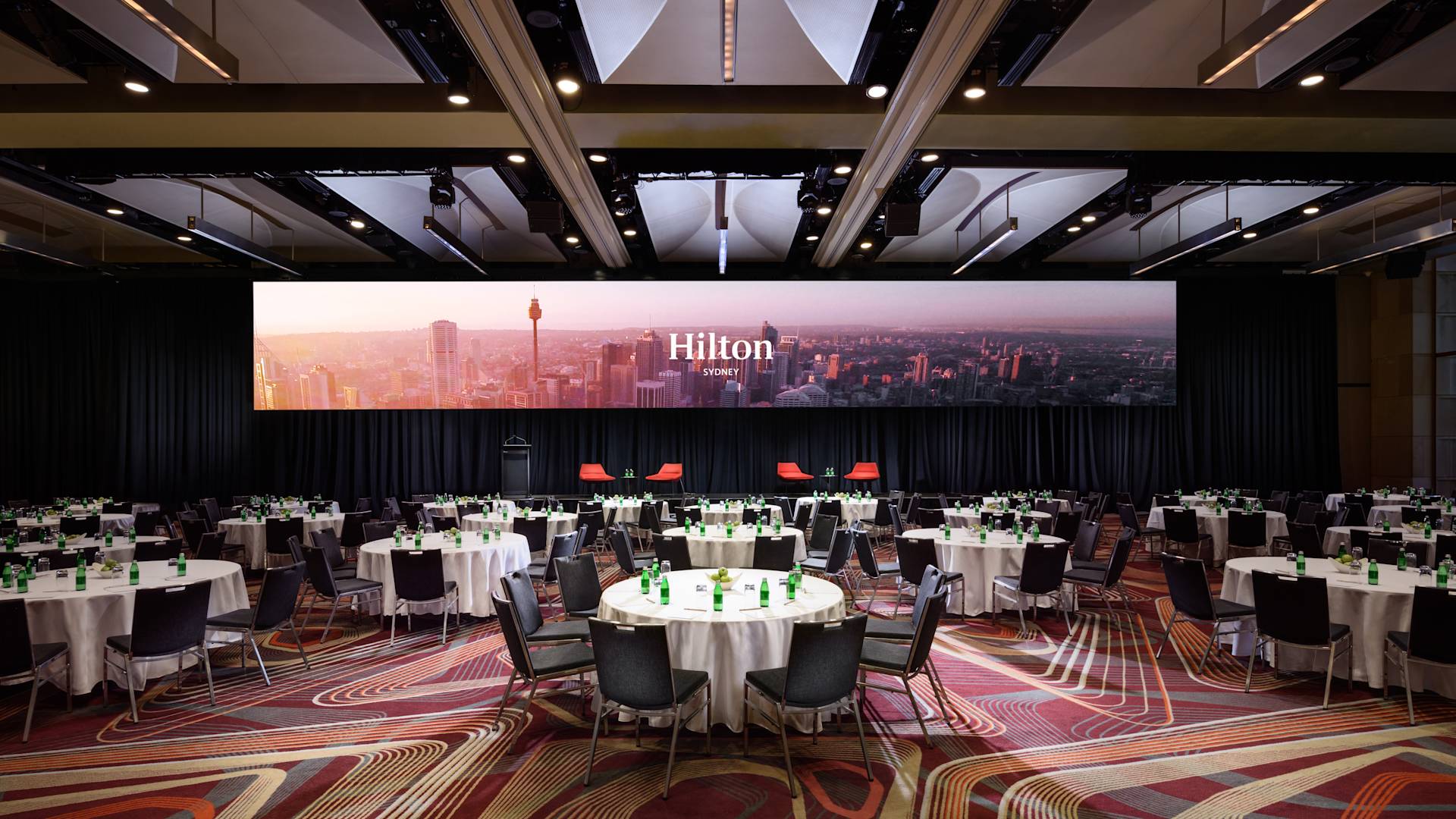 tables and large screen in Grand Ballroom