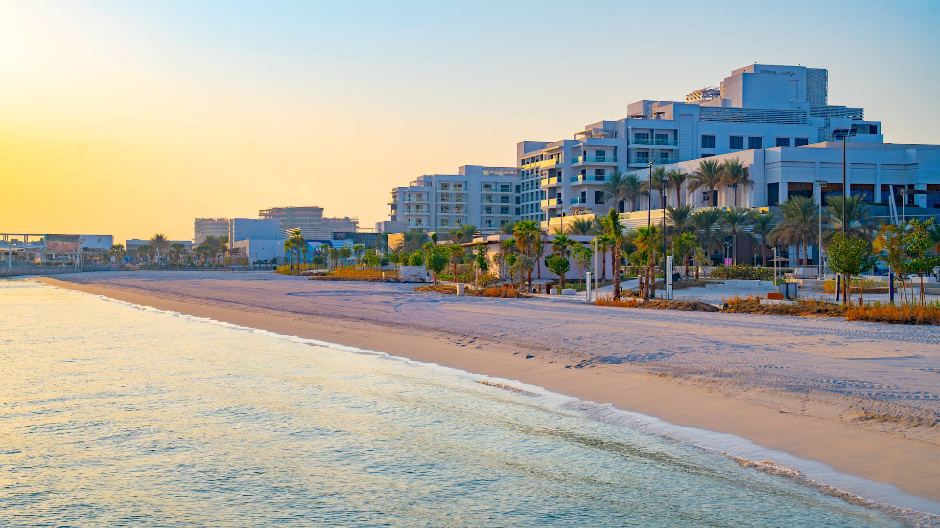 Hotel Exterior with View of the Beach at Sunset