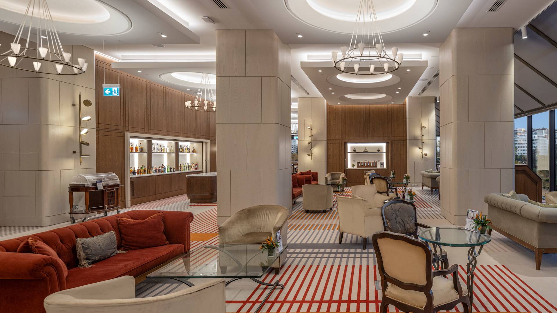 Sitting Area in Lobby with Large Windows and City View