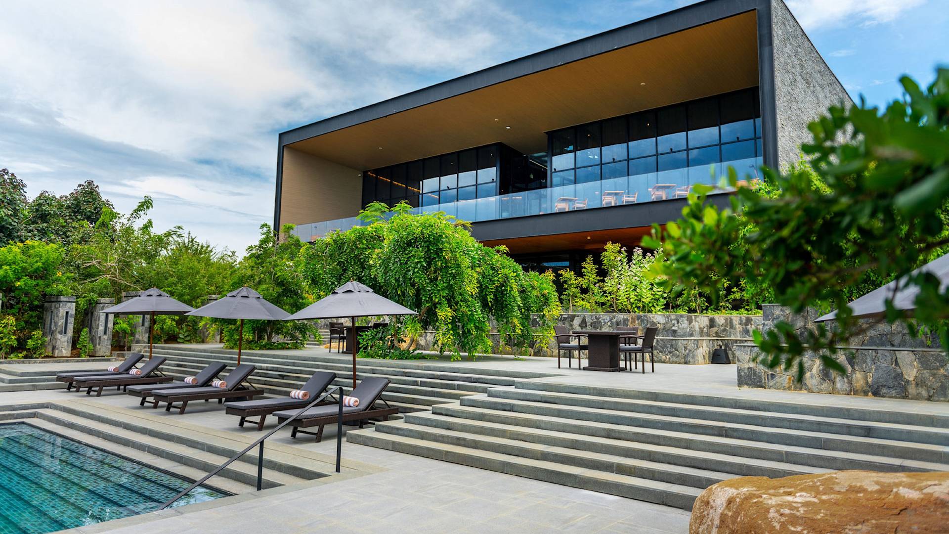 Outdoor Pool Area with Lounge Chairs